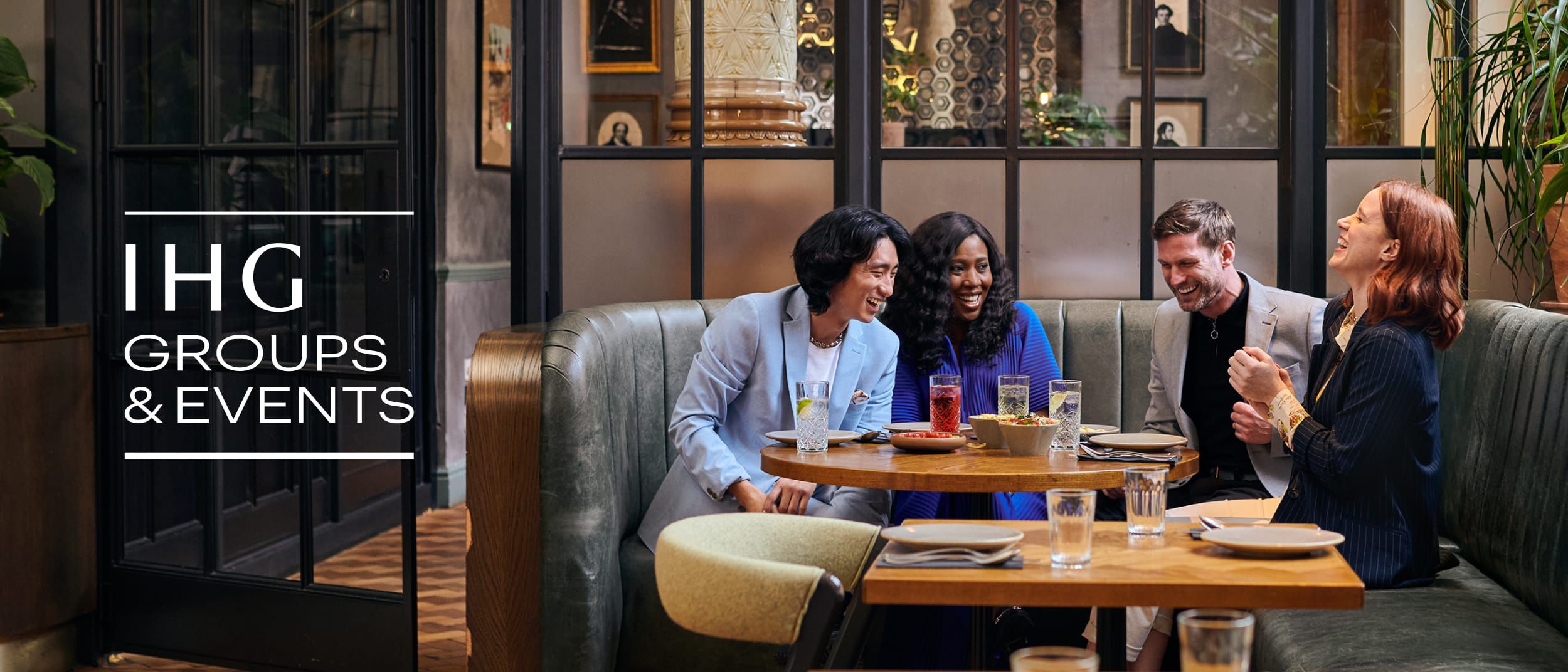 Group enjoying a meal together in a hotel restaurant.