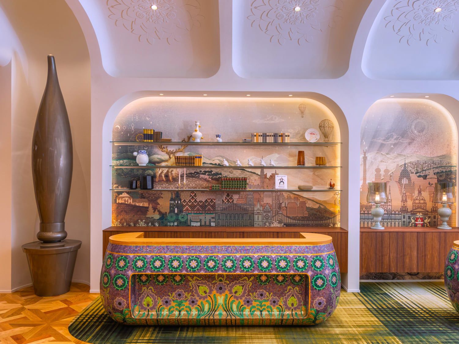 Hotel check-in with tiled desk of purple and green flowers