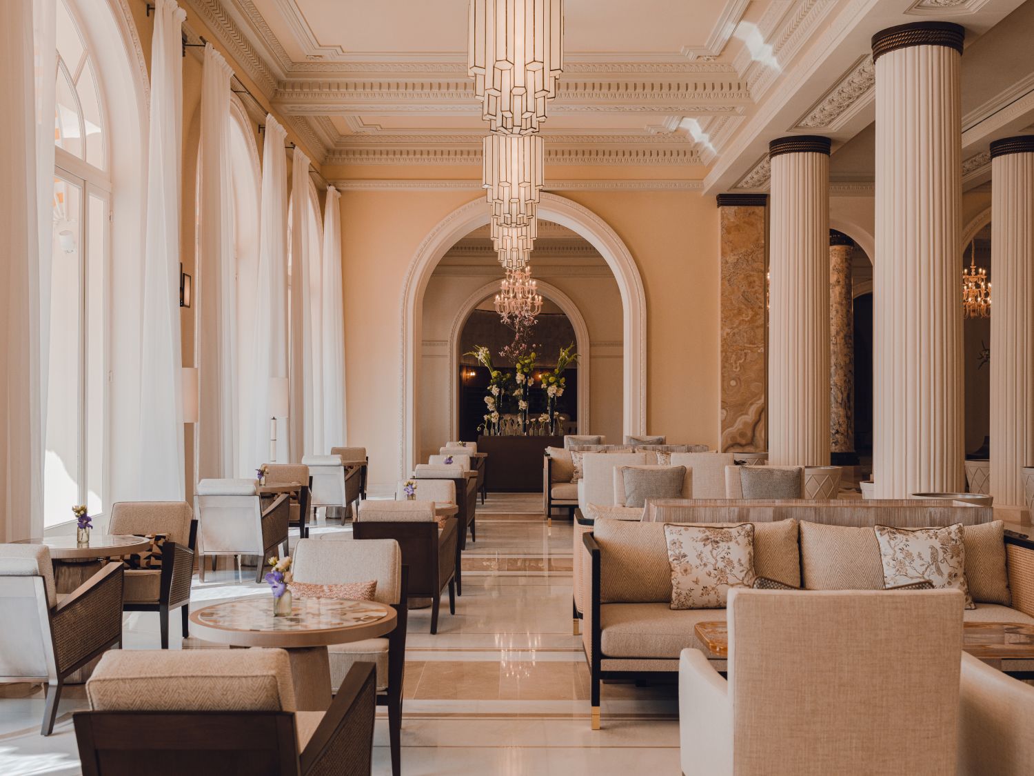Restaurant and seating area with large chandeliers
