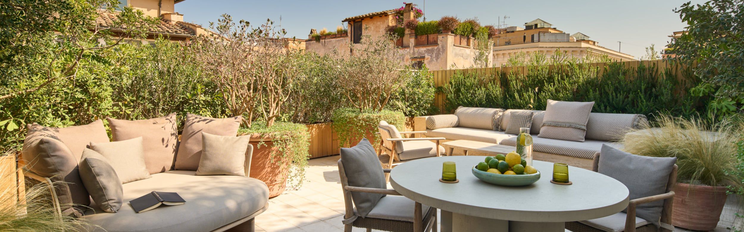 Outdoor area with table, chairs, and lounge seating