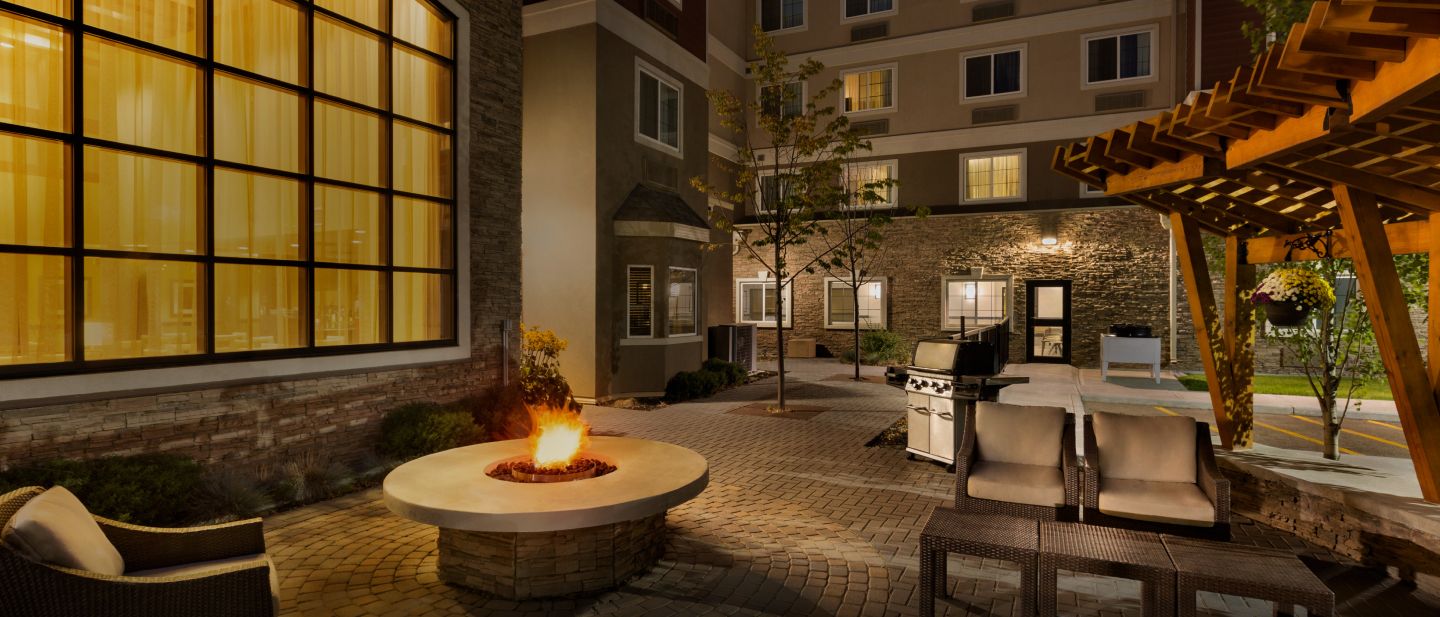 Patio scene with fire pit at Staybridge Suites West Edmonton