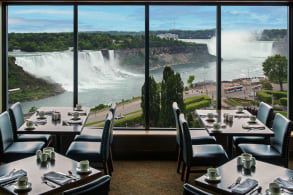 A lobby image with a huge window looking straight out to the falls