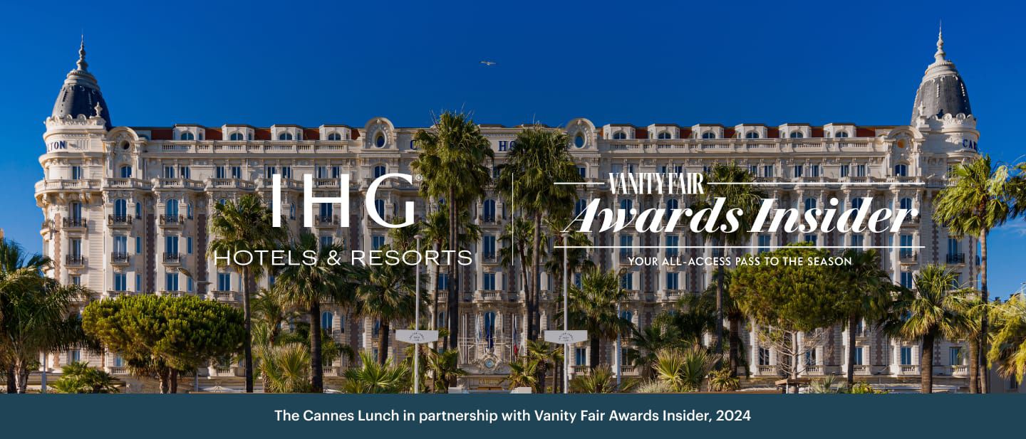 dramatic grand and ornate hotel with palm trees in foreground