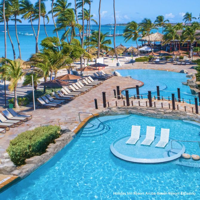 Vibrant pool with luxurious lounge areas at the Holiday Inn Resort Aruba-Beach Resort & Casino