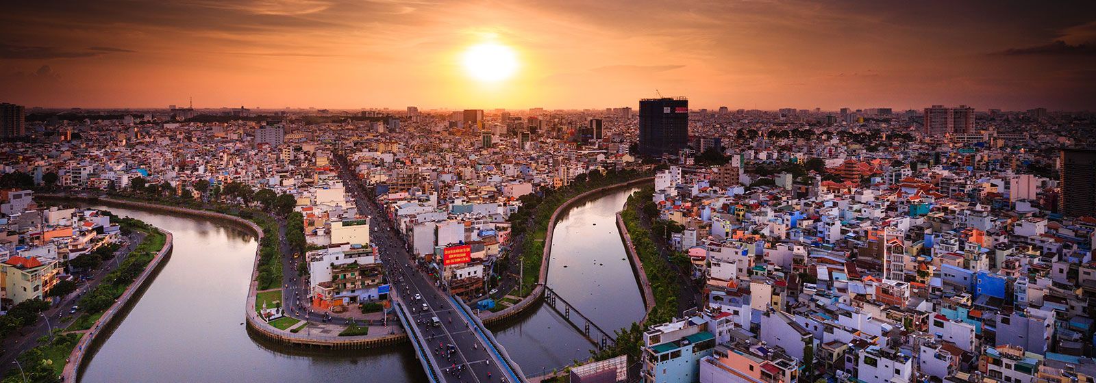 River winding through Ho Chi Minh city scape and dusk