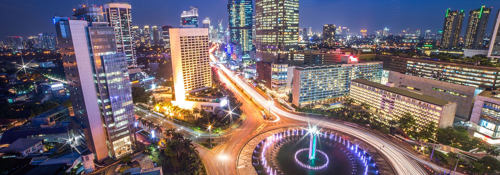 Jakarta cityscape lit up at night 