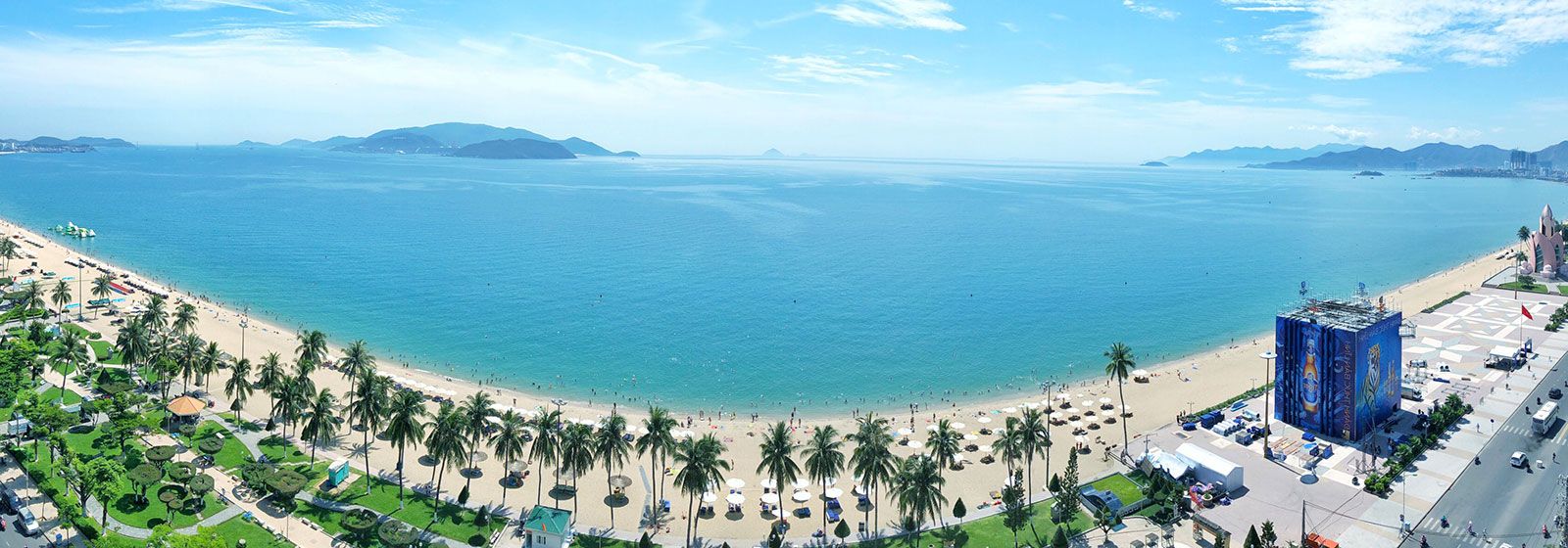 view of the ocean and white sand beach with palm trees 