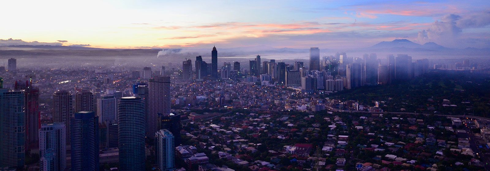 Arial view of Pasay city at dawn with a cloudy sky