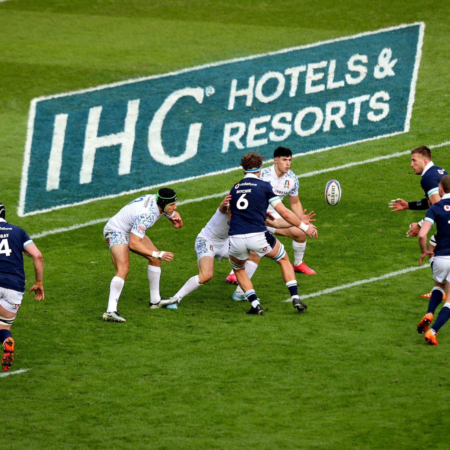 Six Rugby players on the pitch mid match at the Guinness Men's Six Nations