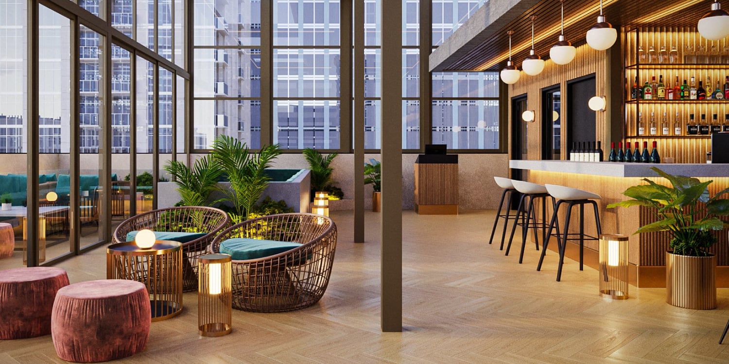 A modern glass-wrapped bar and lounge overlooking the city.