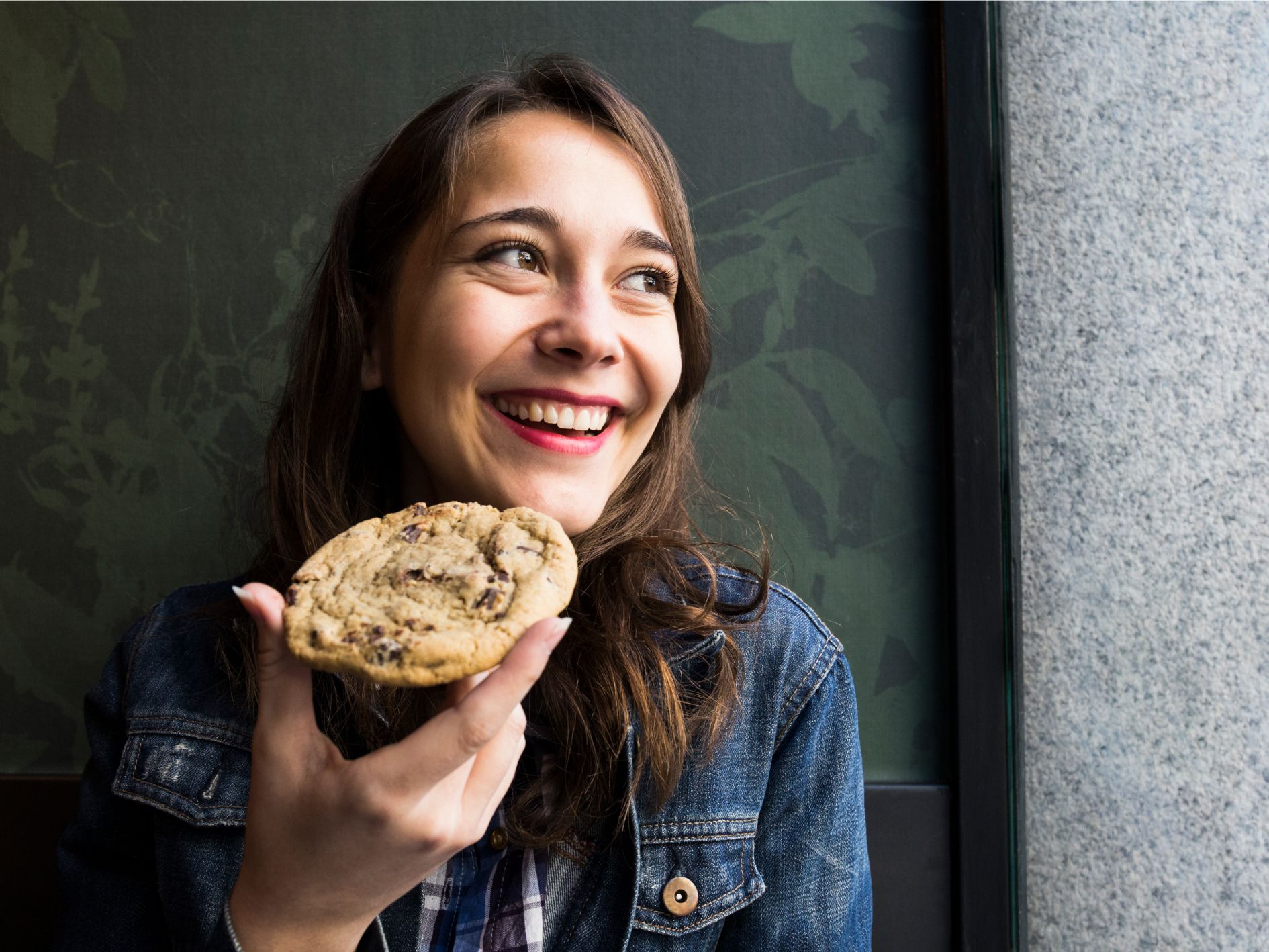 A person holding a cookie