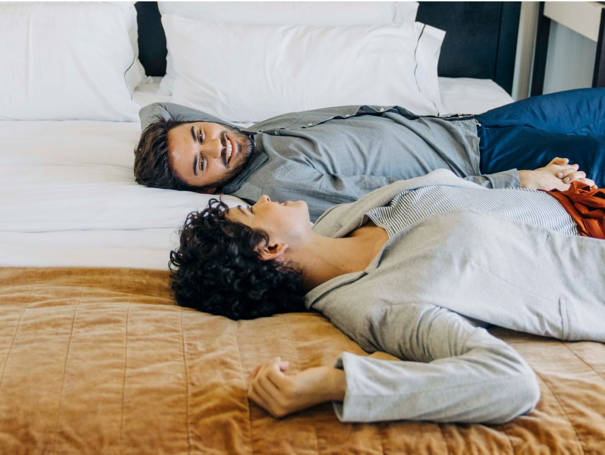 Hotel bed with white sheets