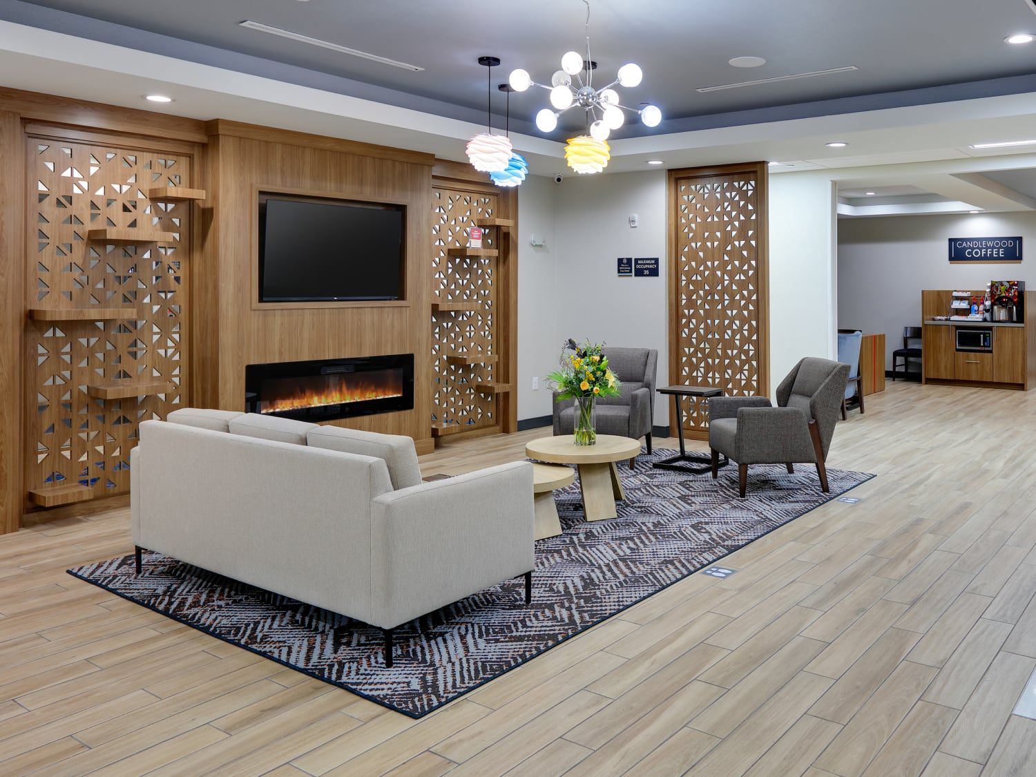 Fireside seating in the lobby of Candlewood Suites DFW West-Hurst