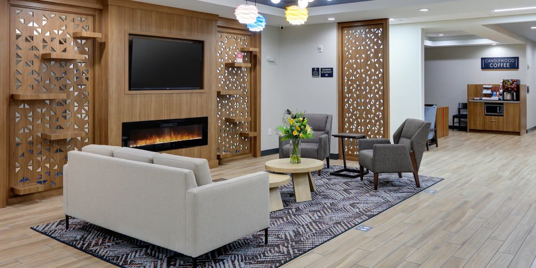 Fireside seating in the lobby of Candlewood Suites DFW West-Hurst