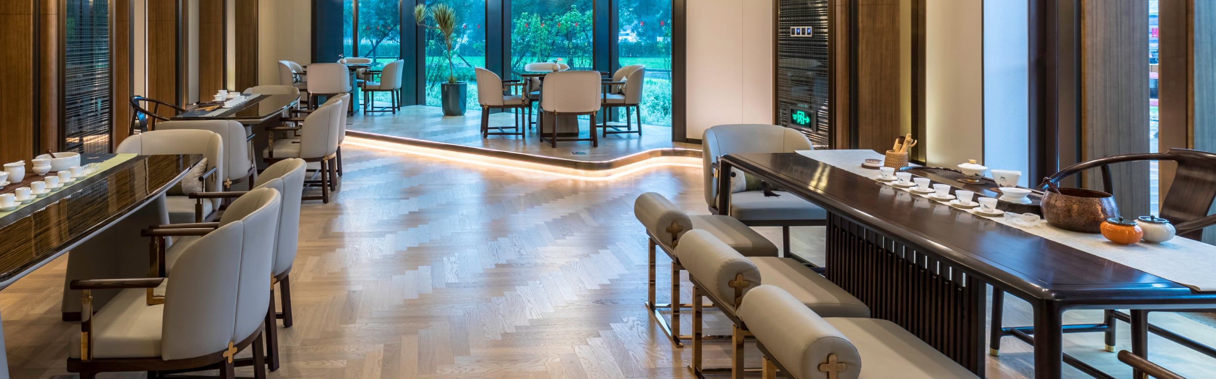 Modern restaurant with floor-to-ceiling windows at HUALUXE Beijing Xinan