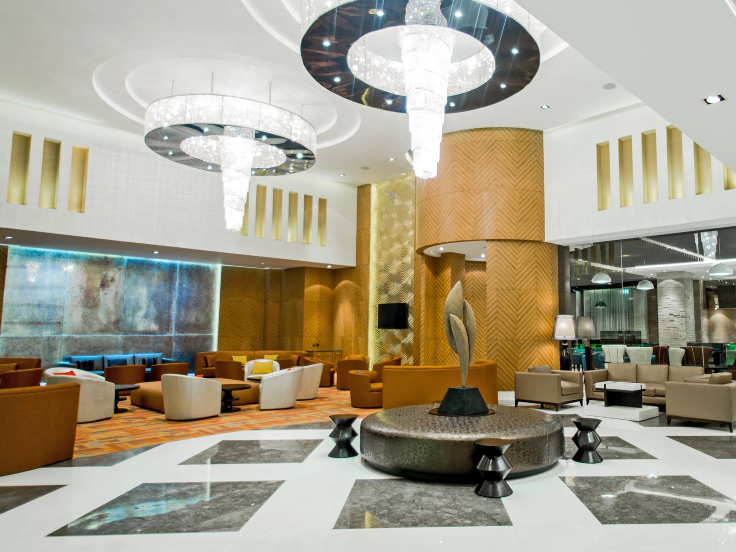 Sparkling chandeliers and shades of gold greet guests at Holiday Inn Amritsar Ranjit Avenue.