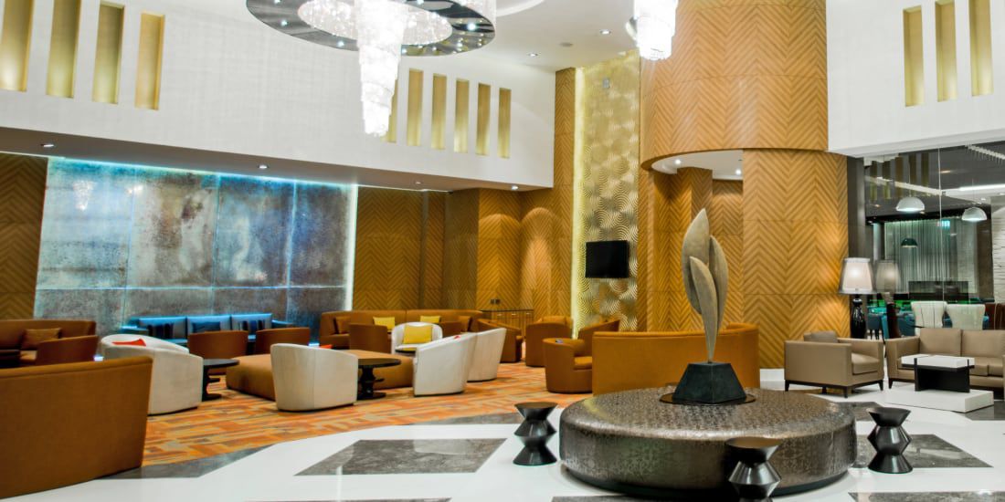 Sparkling chandeliers and shades of gold greet guests at Holiday Inn Amritsar Ranjit Avenue.