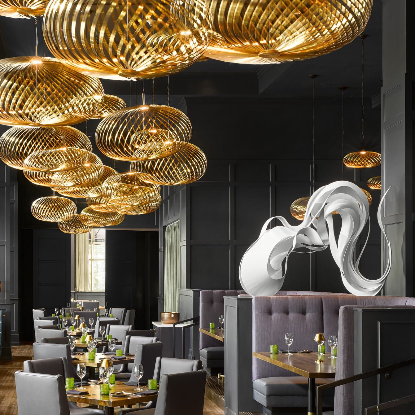 A moody grand dining space, decked out in sculptural art.