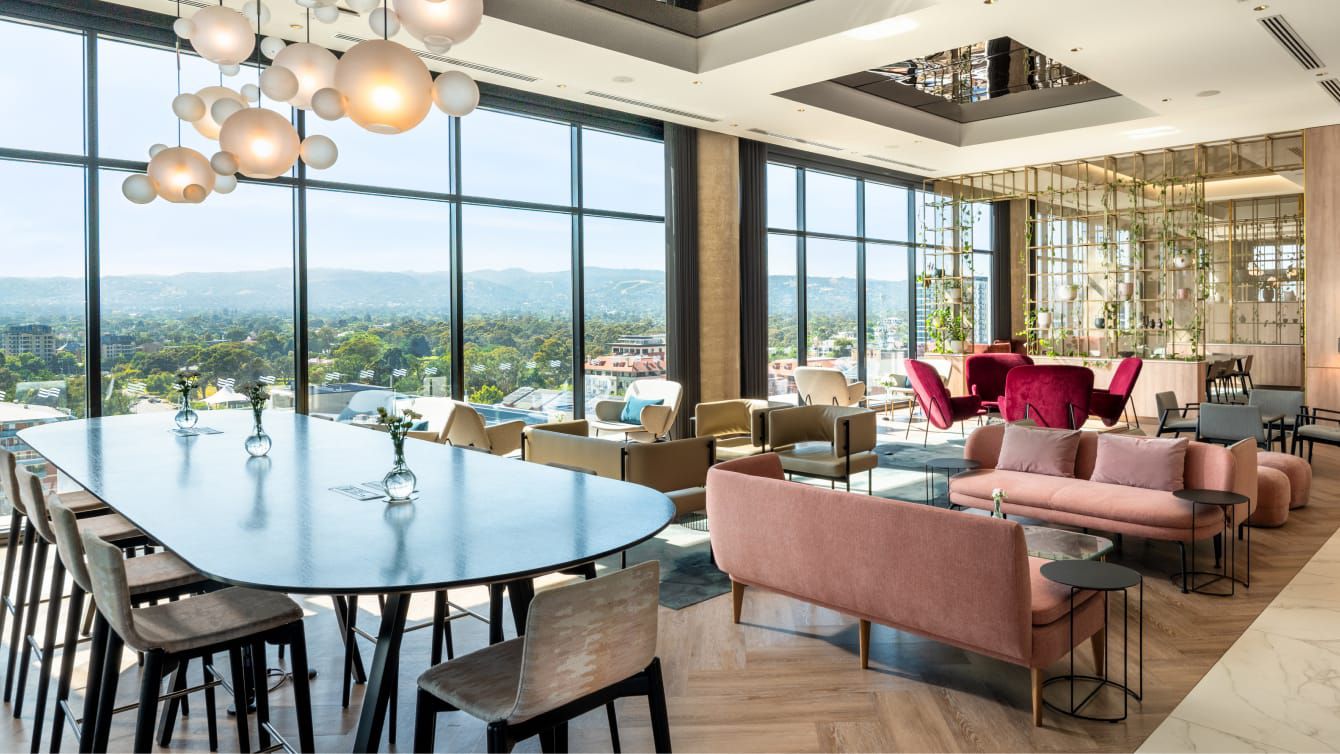 A celebratory gathering space for intimate dinners and cocktail hours overlooking the city.