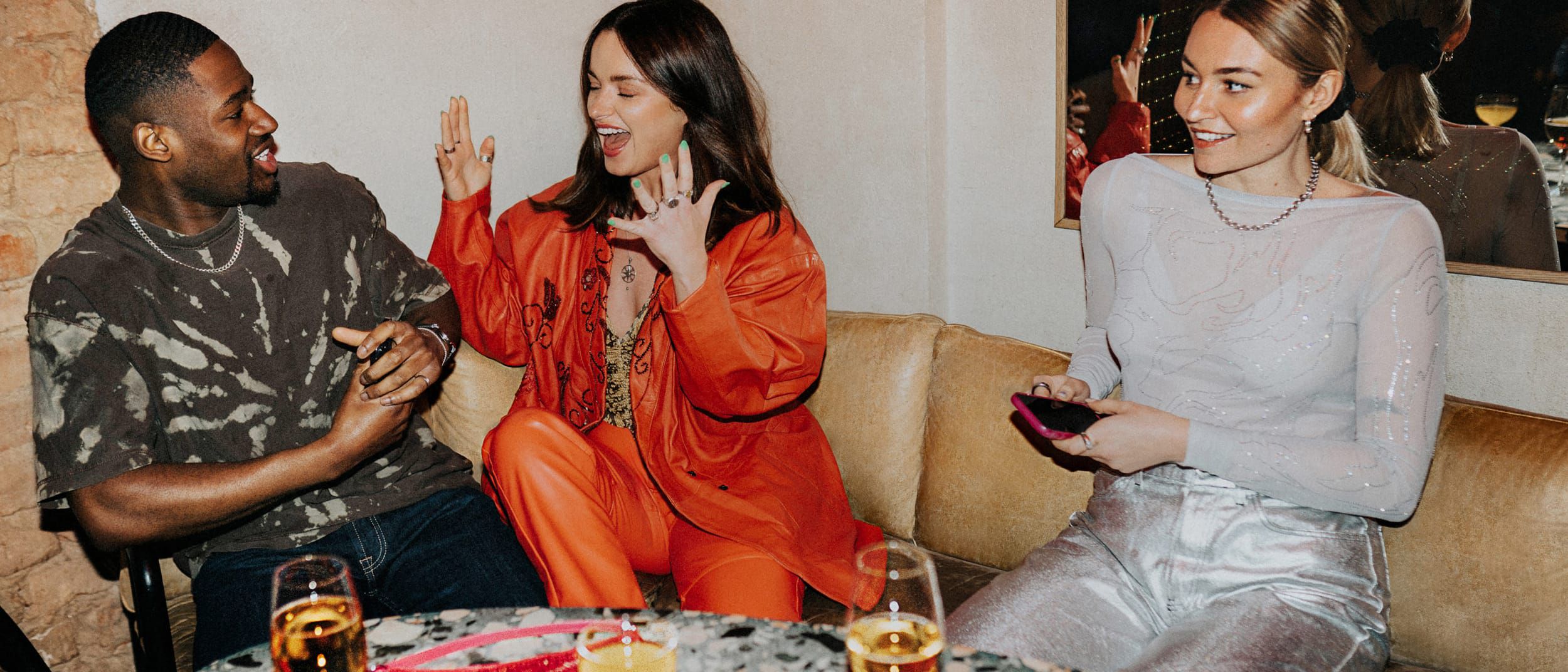 Guests enjoying cocktails and lively conversation.