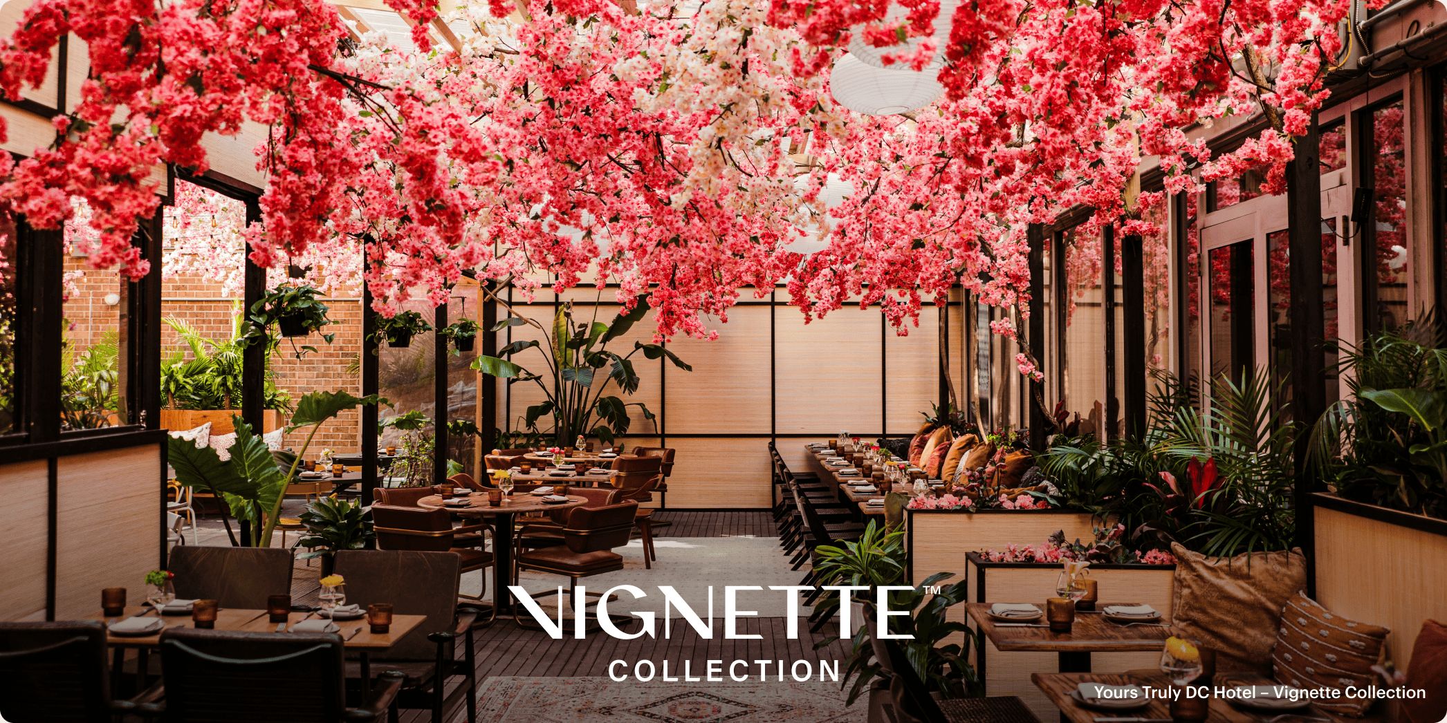 restaurant dining room with dramatic flower decor across the ceiling