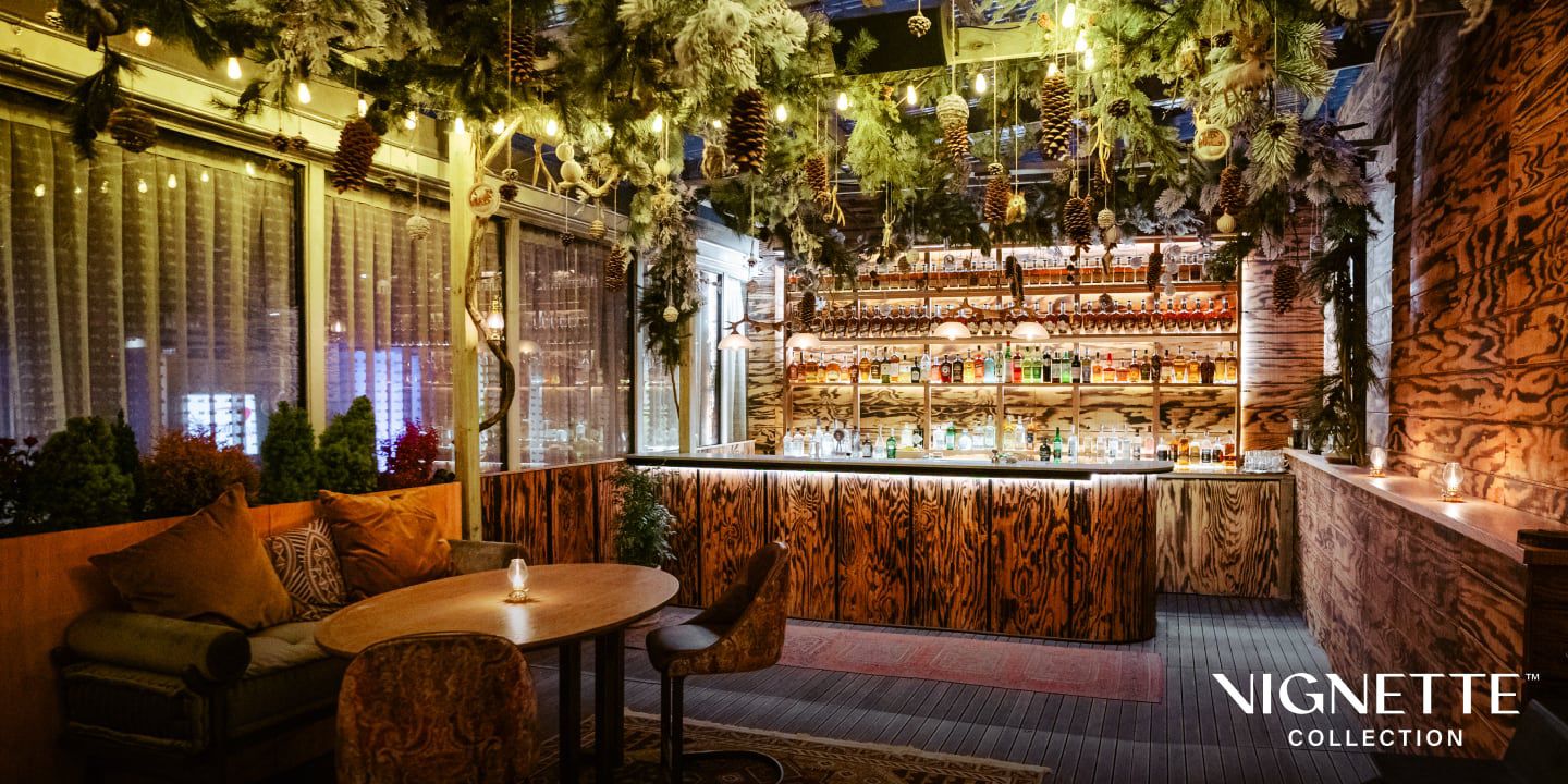 Vignette bar and lounge area with lights and winter greenery decoration