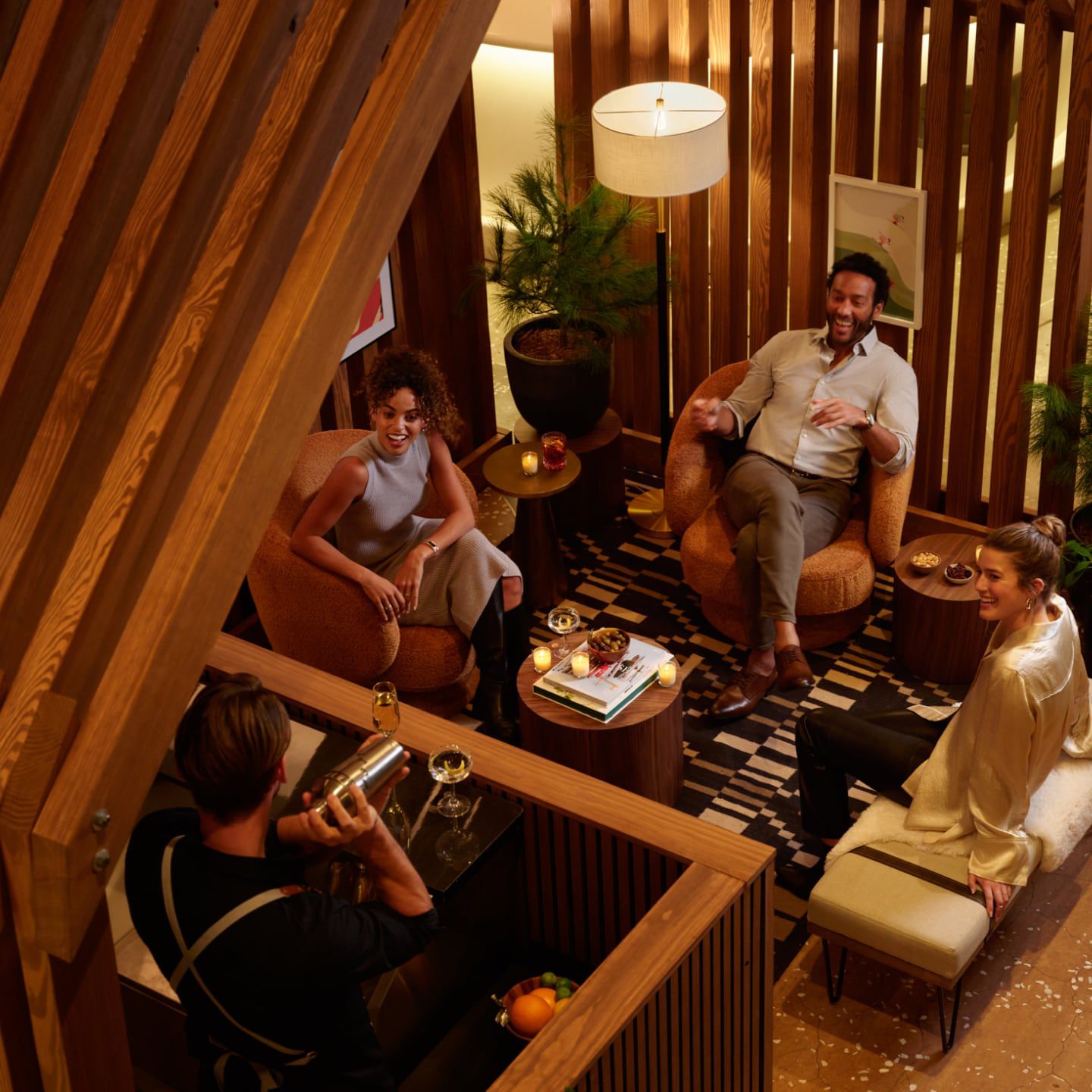 people lounging in a luxurious lobby decorated for winter