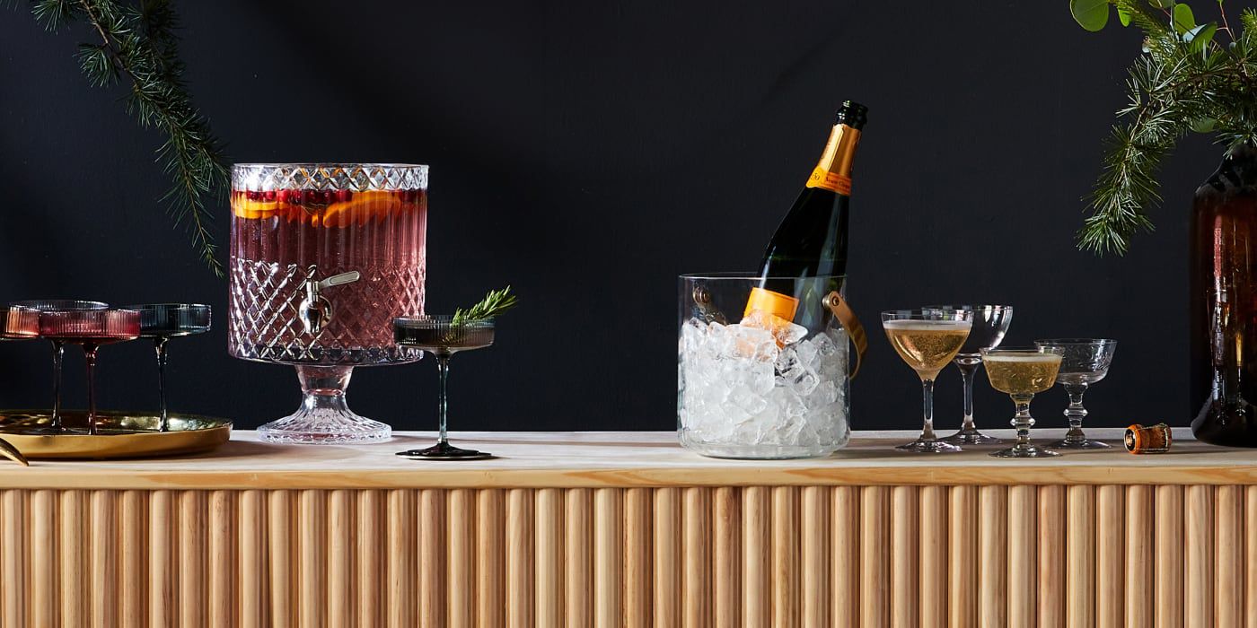 a bar with cocktails and holiday adornment
