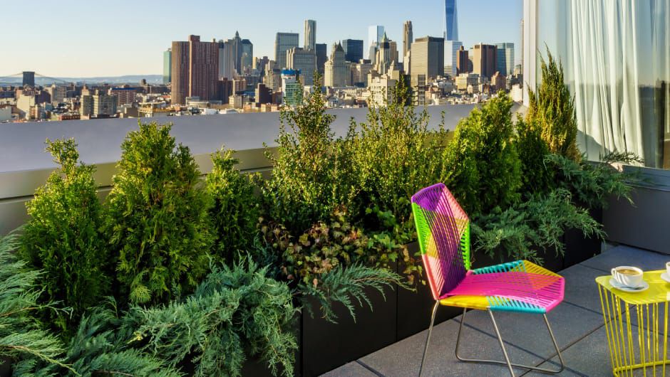 Colorful chair on patio overlooking NYC skyline