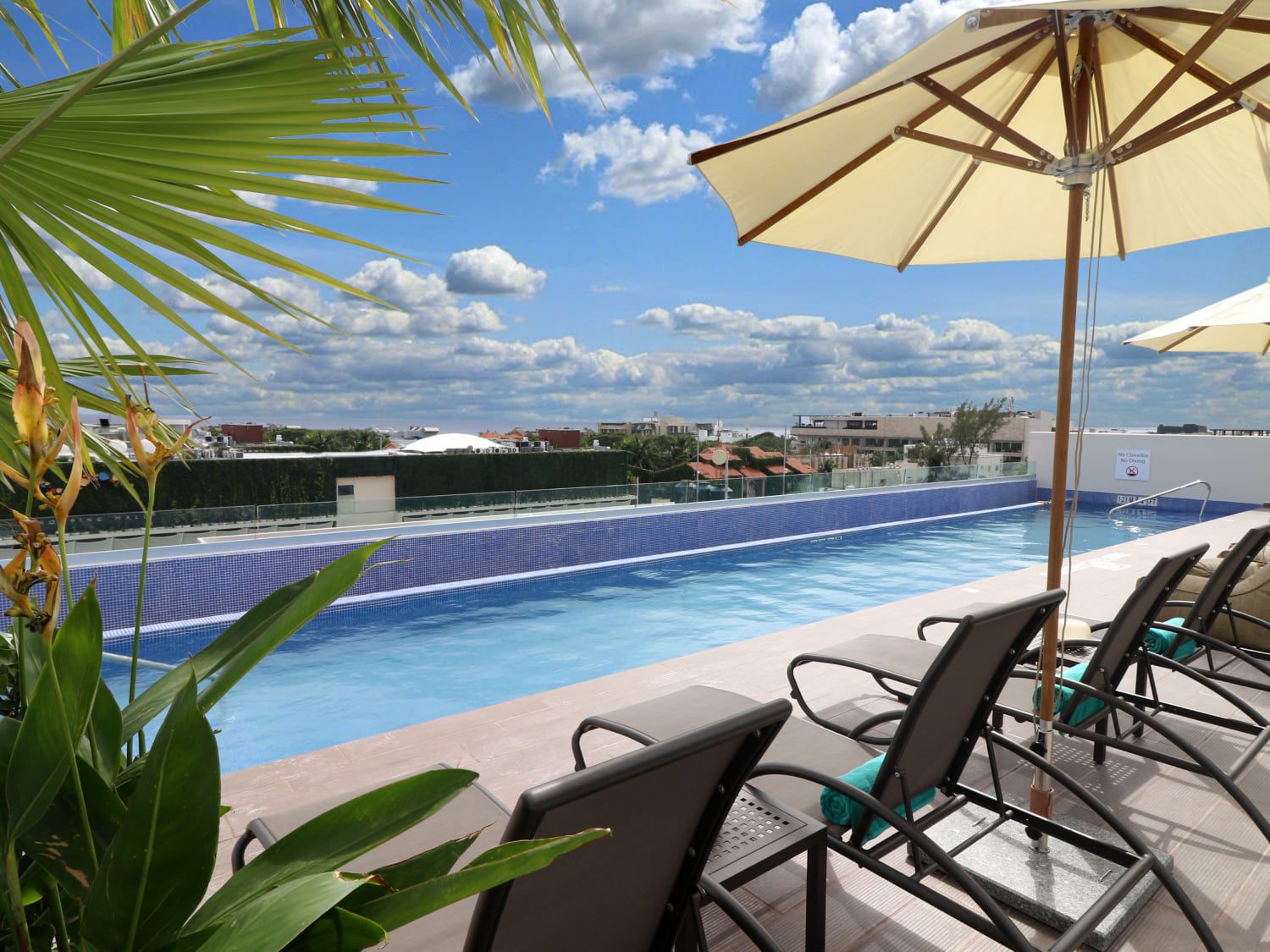 Sunny rooftop pool at Holiday Inn Express & Suites Playa del Carmen