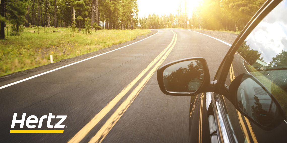 Car driving down winding road