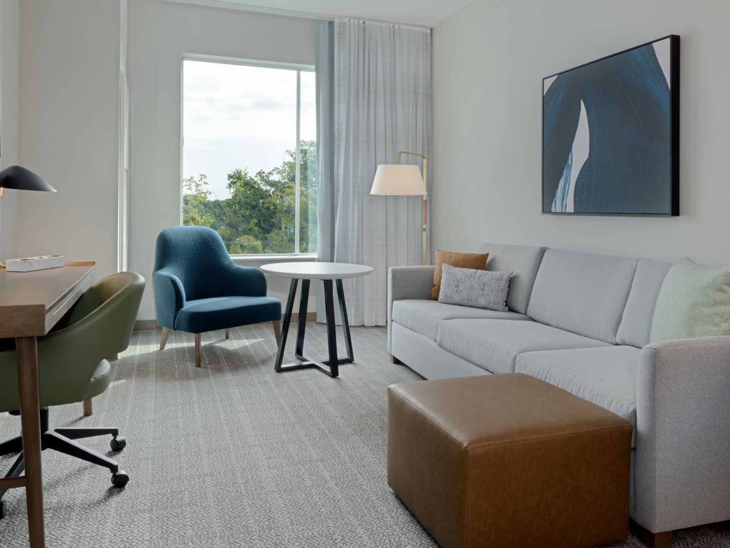 Modern EVEN Hotel common area with lounge seating