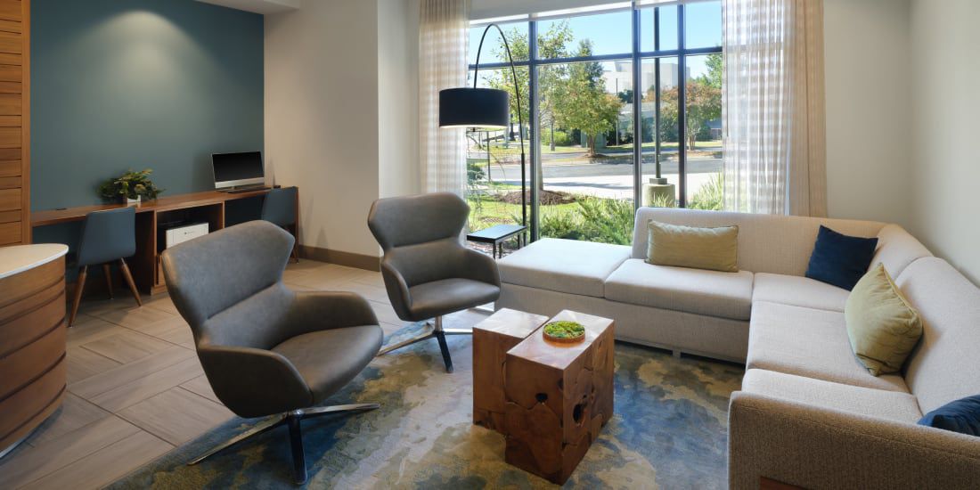 Modern EVEN Hotel common area with lounge seating
