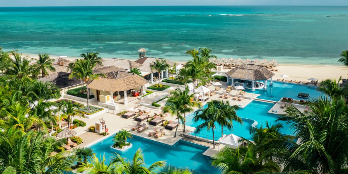 Aerial shot of crystal clear pools and ocean