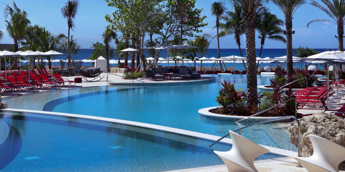 Infinity pool overlooking crystal blue ocean