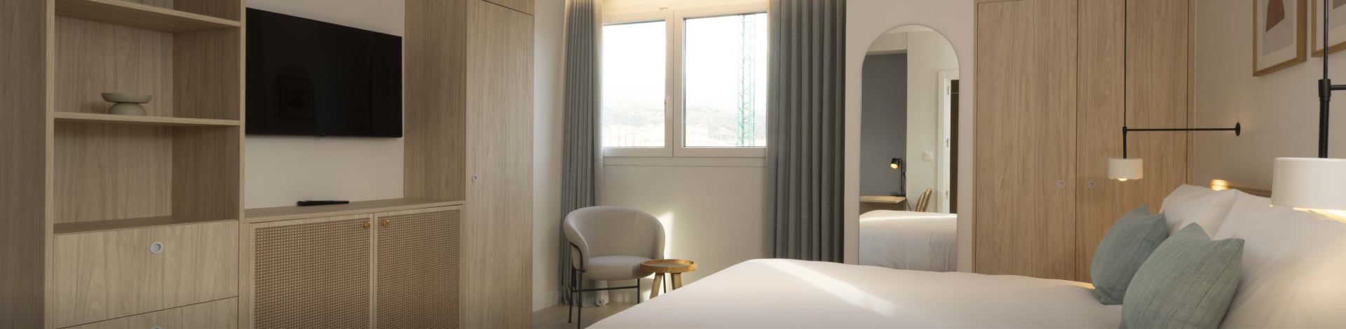 Modern, serene guest room at Staybridge Suites Malaga