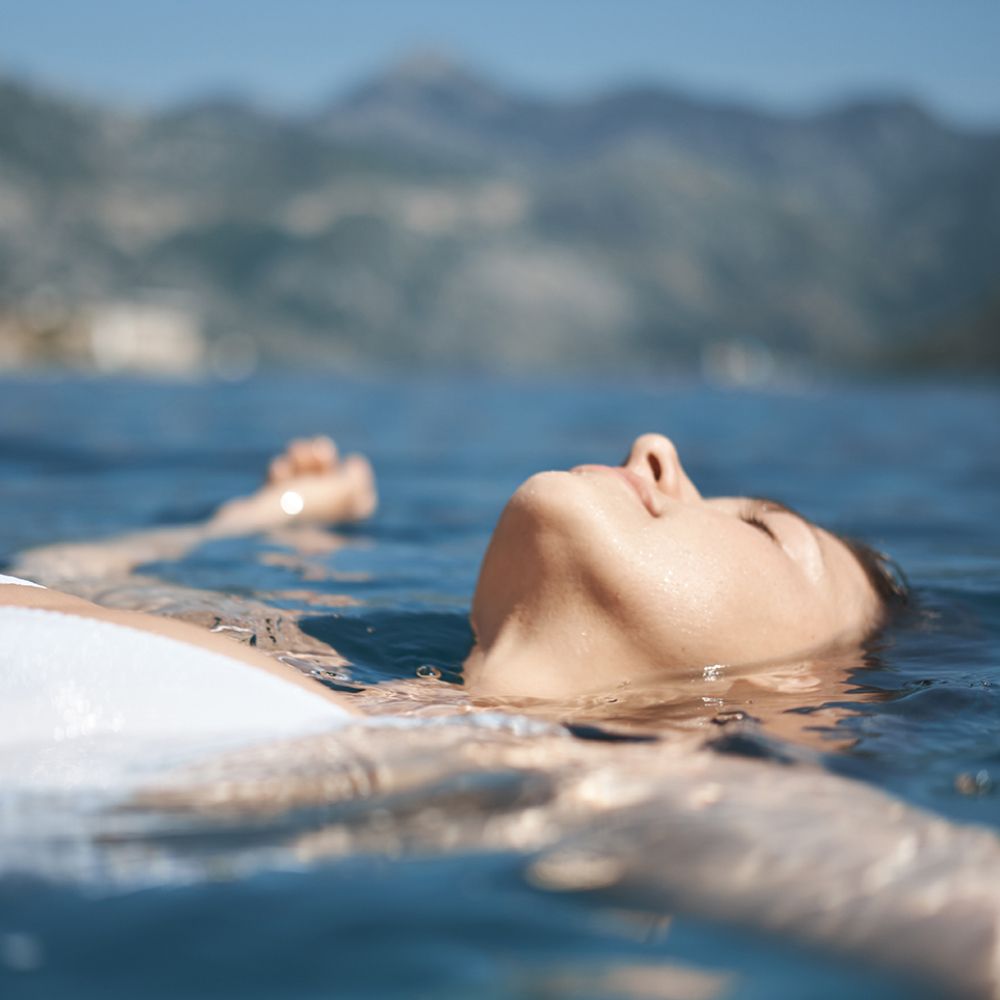 Woman relaxing in ocean