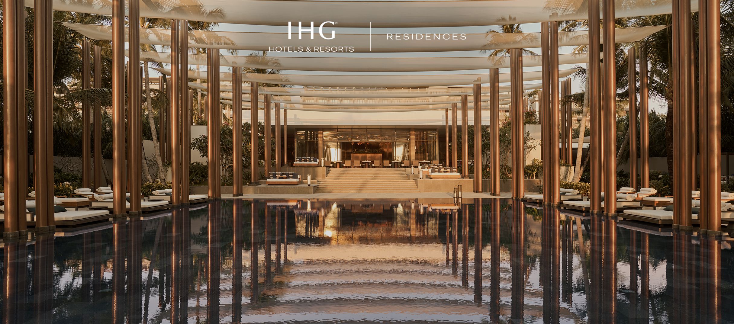 Luxury resort-style residence lobby with reflective pool