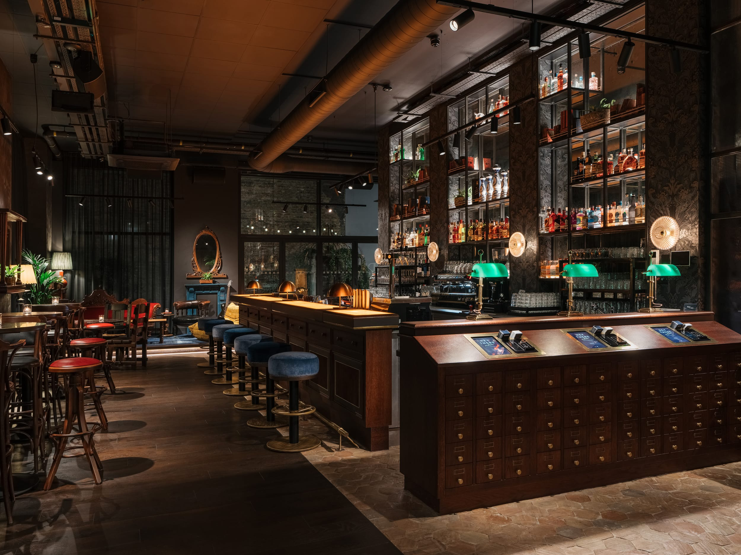 A corner bistro table overlooking a bar in a hotel