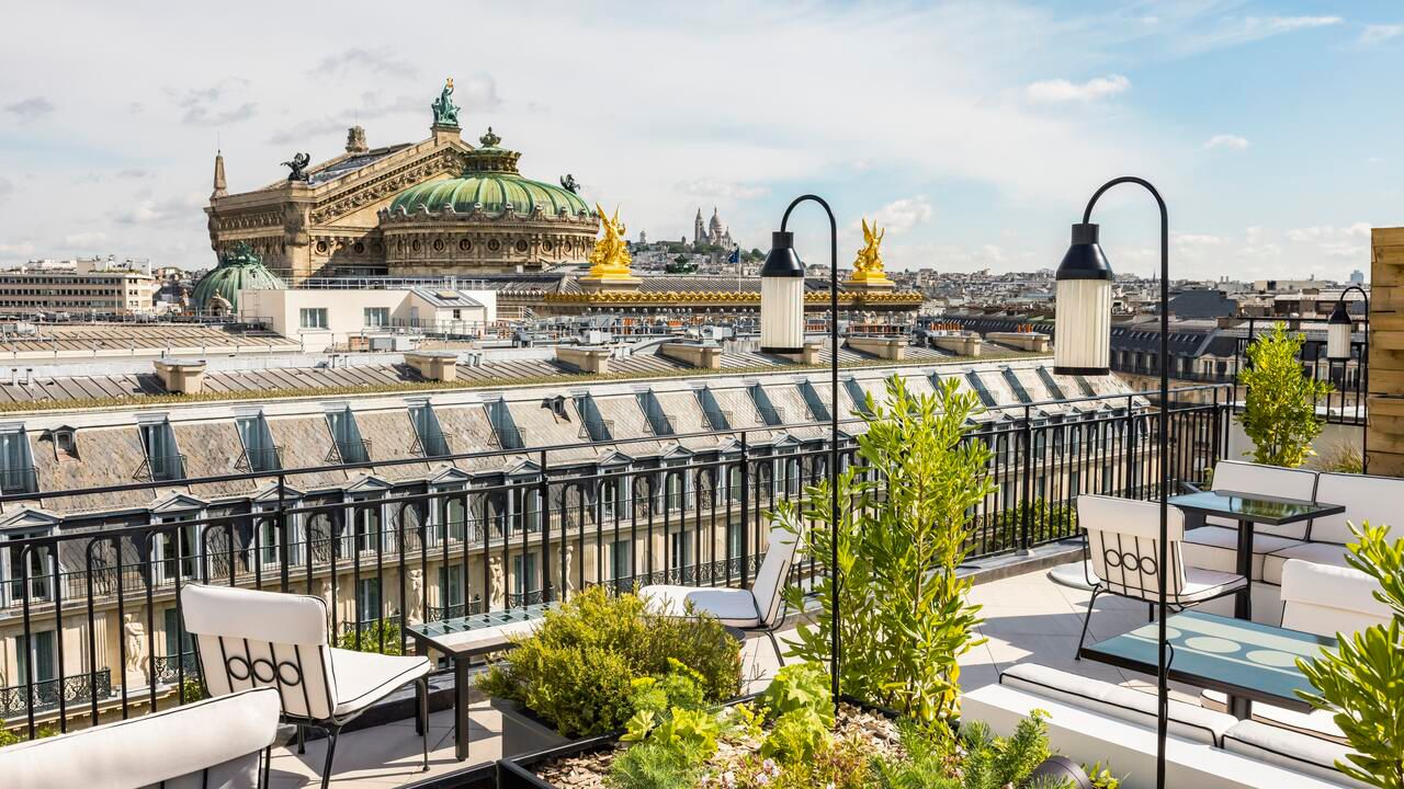 rooftop terrace overlooking paris on a sunny day