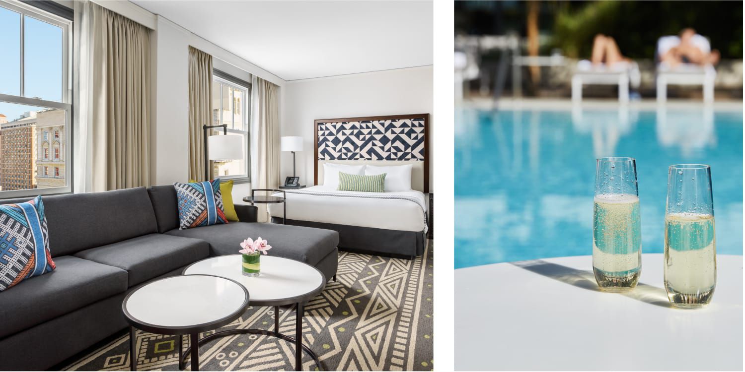 A hotel room features a couch, a coffee table, and geometric patterns in the headboard, throw pillows, and rug. / Two glasses of something sparkling sit poolside.