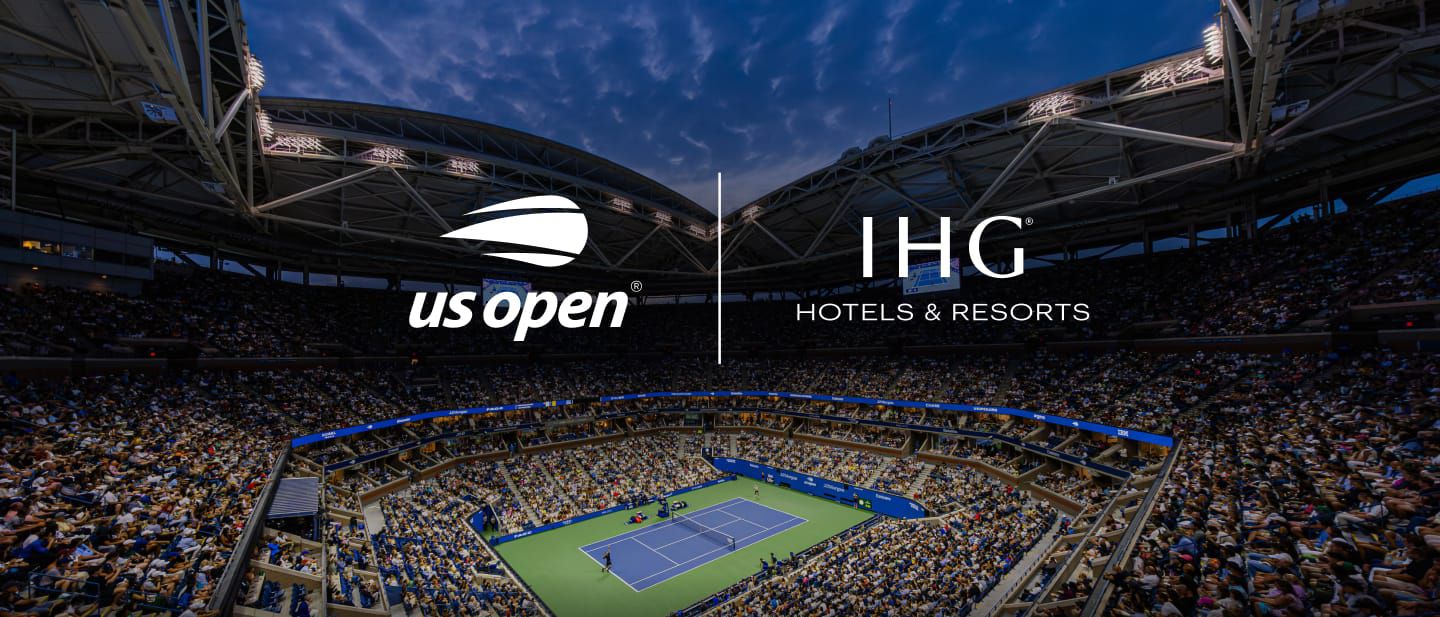 US Open logo and IHG Hotels and Resorts logo overlooking the tennis stadium