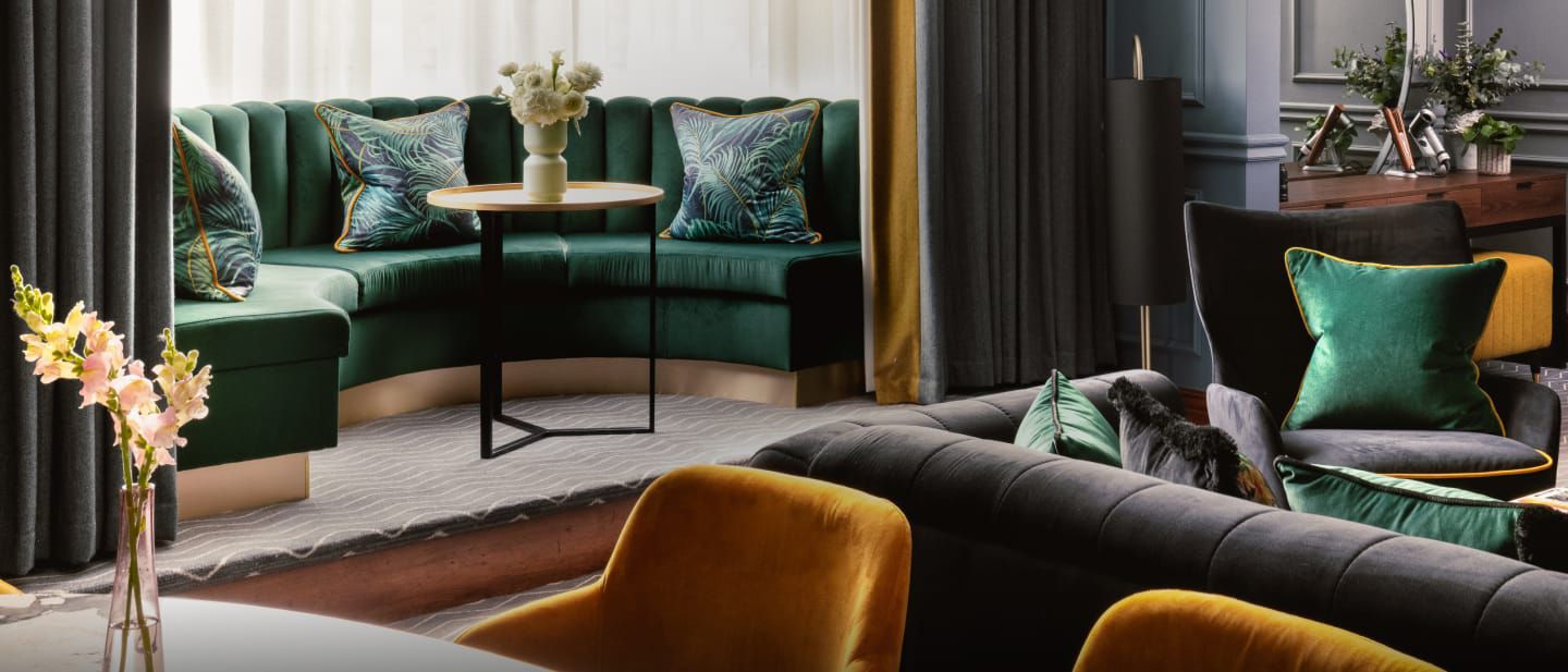 Image of sofa's in a Kimpton Clocktower Hotel room