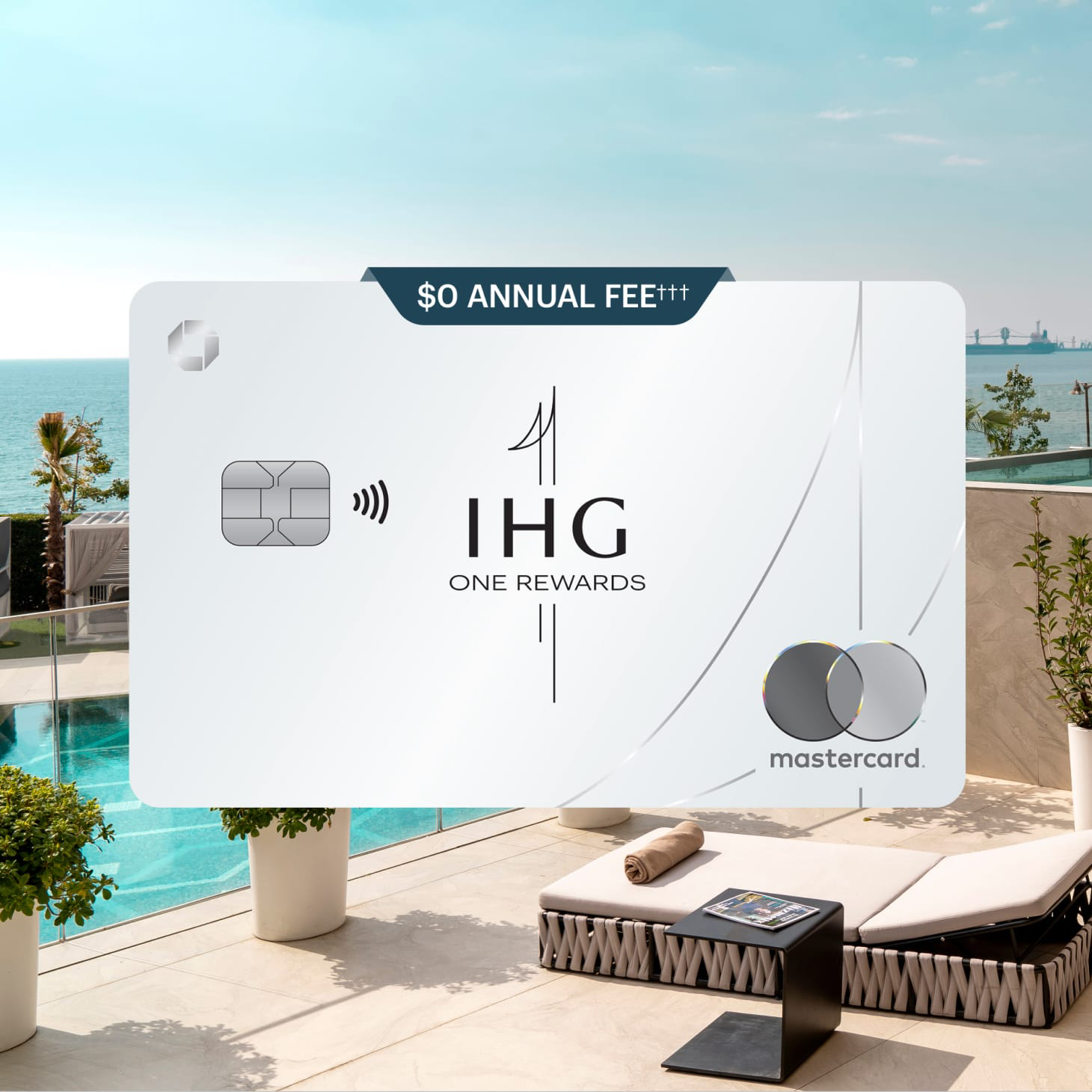 IHG One Rewards Credit Card overlaid on scene of an outdoor pool on the water.