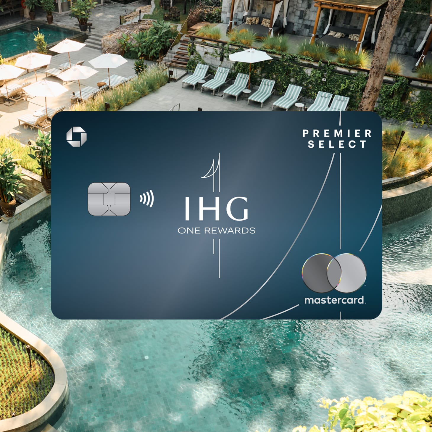 IHG One Rewards Premier Select Credit Card overlaid on scene of pool with umbrellas and foliage.