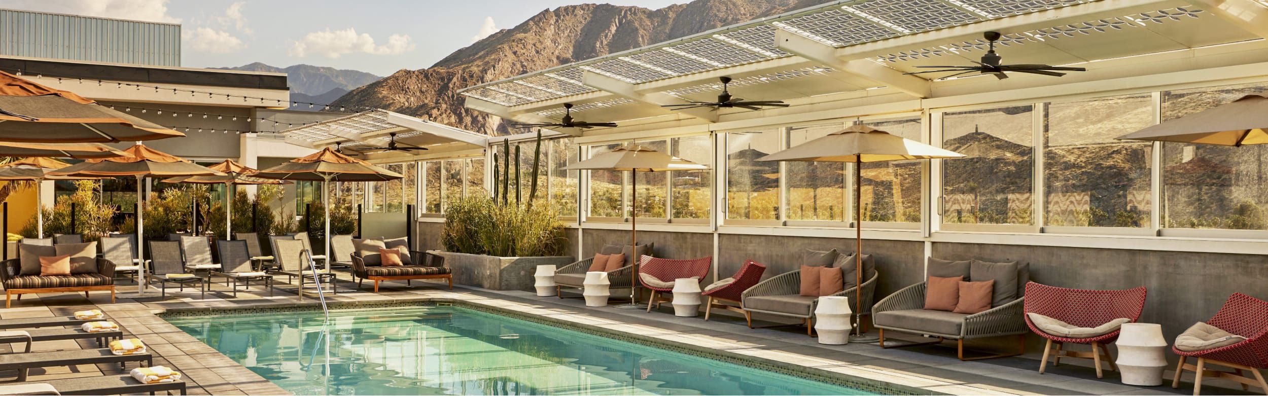 Outdoor pool in the shadow of the mountains.
