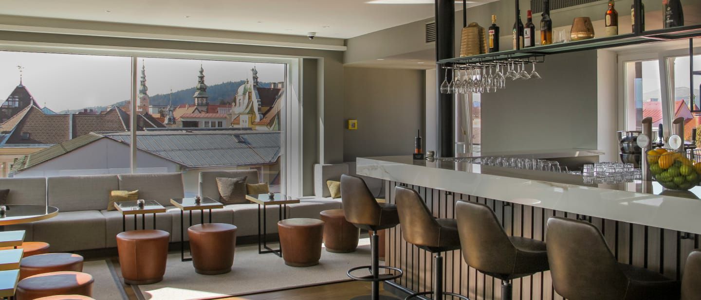 A food &amp; beverage space with chairs and a window