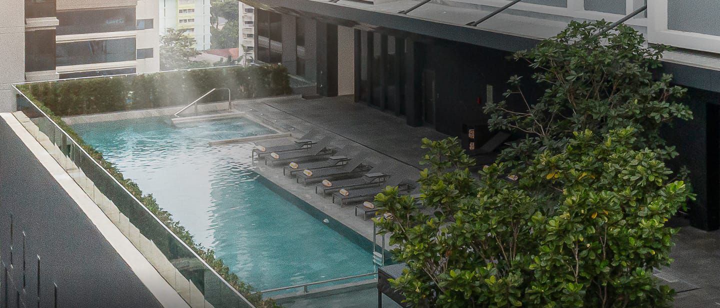 A picture containing outdoor pool scene and hotel building
