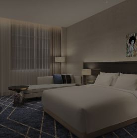 Background image of a sleek hotel room.