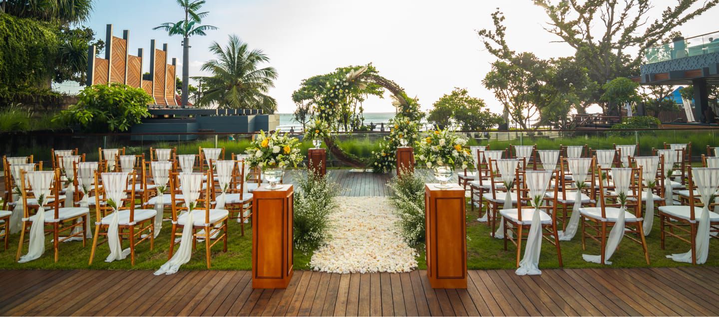 Outdoor wedding ceremony setup overlooking ocean